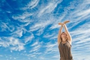 Lady doing Yoga facing the sky