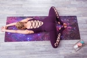 Lady doing yoga on a yoga mat